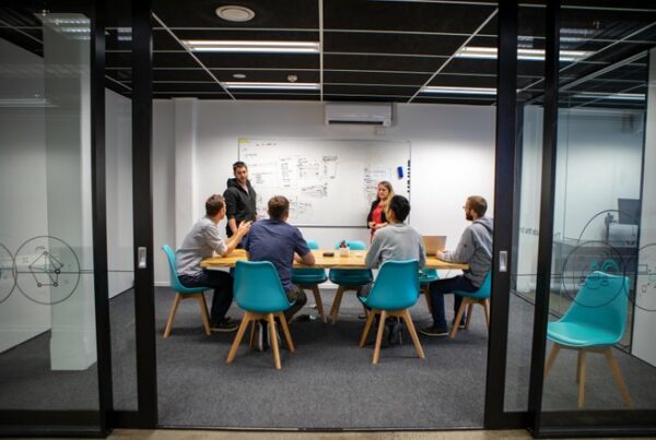 People sitting around a meeting table